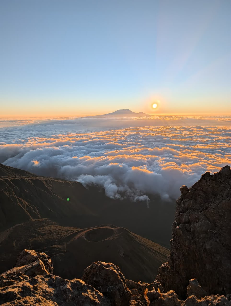 Kilimanjaro above the clouds at sunrise, from the ridge